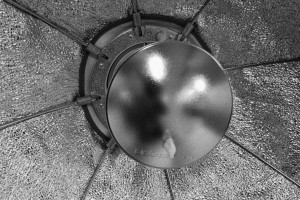 Inside view of a beauty dish, the photographer is in a reflection at the centre