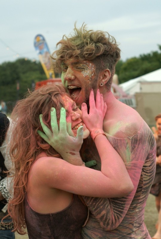 Beach break Live festival event photography Man and woman in coloured paint at Beach Break Live festival