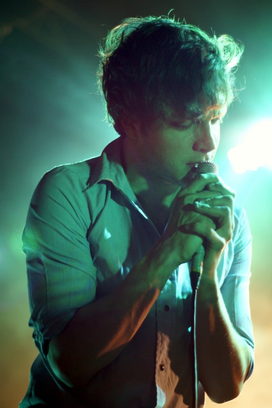 Ed Macfarlane from Friendly Fires gig photography Man singing into a microphone