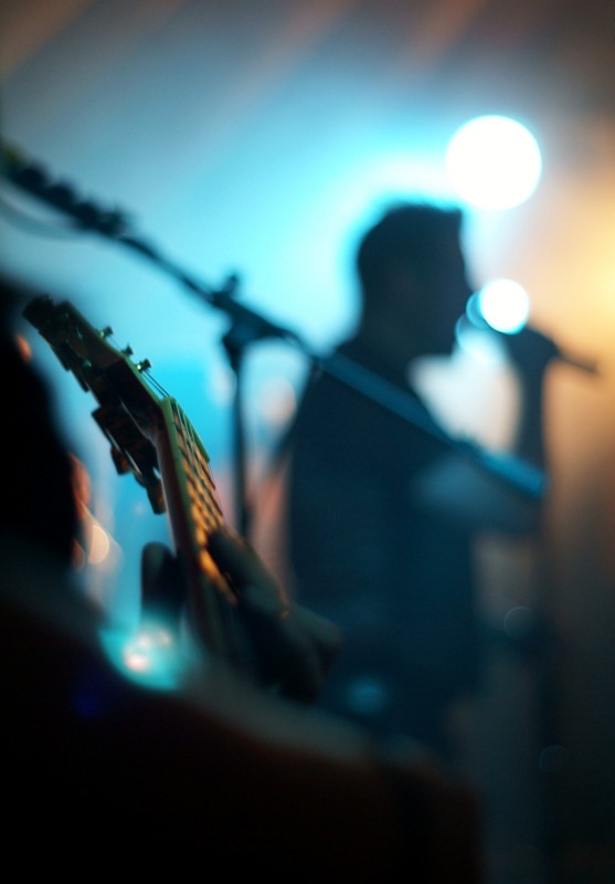 Mister Sister gig photographer Guitar in foreground and singer in background