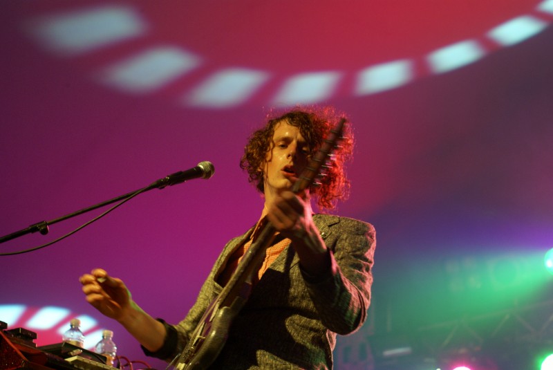 Mystery jets at Beach Break Live Man playing a guitar