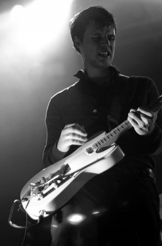 White Lies gig photographer Guitarist playing his instrument