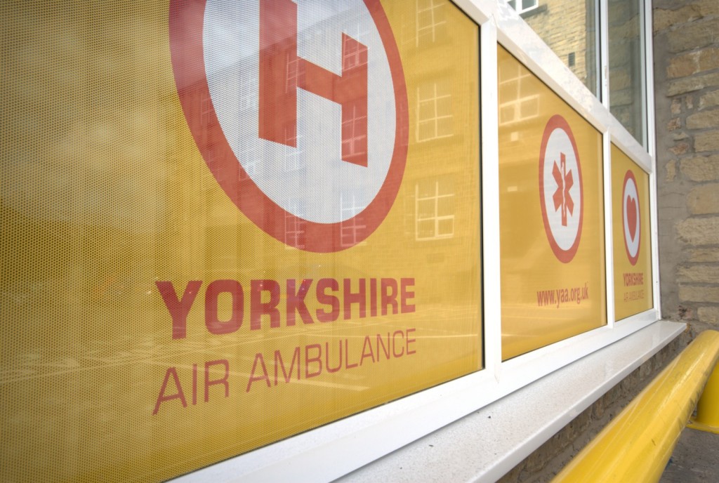 Yorkshire air ambulance PR photography Outside window and logo of Yorkshire air ambulance's headquarters