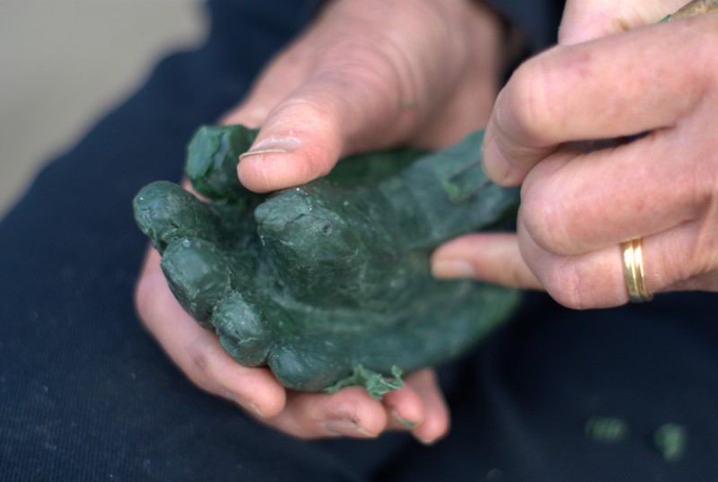Bronze casting art event at Yorkshire Sculpture Park Hands carving a wax sculpture at Yorkshire Sculpture Park