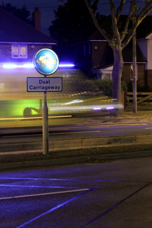 Ambulance light trail A dual carriage way sign in front of blurred light trails left by a speeding ambulance