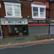 Shop with writing above that says "communication is the key to success"