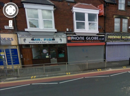 Shop with writing above that says "communication is the key to success"